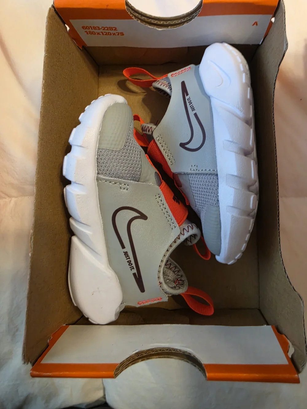 Nike Toddler Slip-On Sneakers in Light Gray, White & Orange